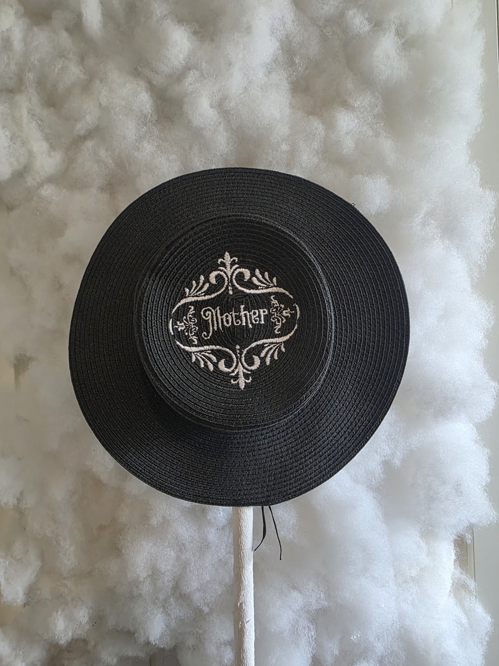 Black Straw Hat with White Embroidered 'Mother' Medallion
